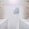 Laundry room with washer, dryer, and storage